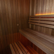 LeisureCraft CT Element Loft Indoor Sauna with wooden interior and glass door for relaxing home spa experience