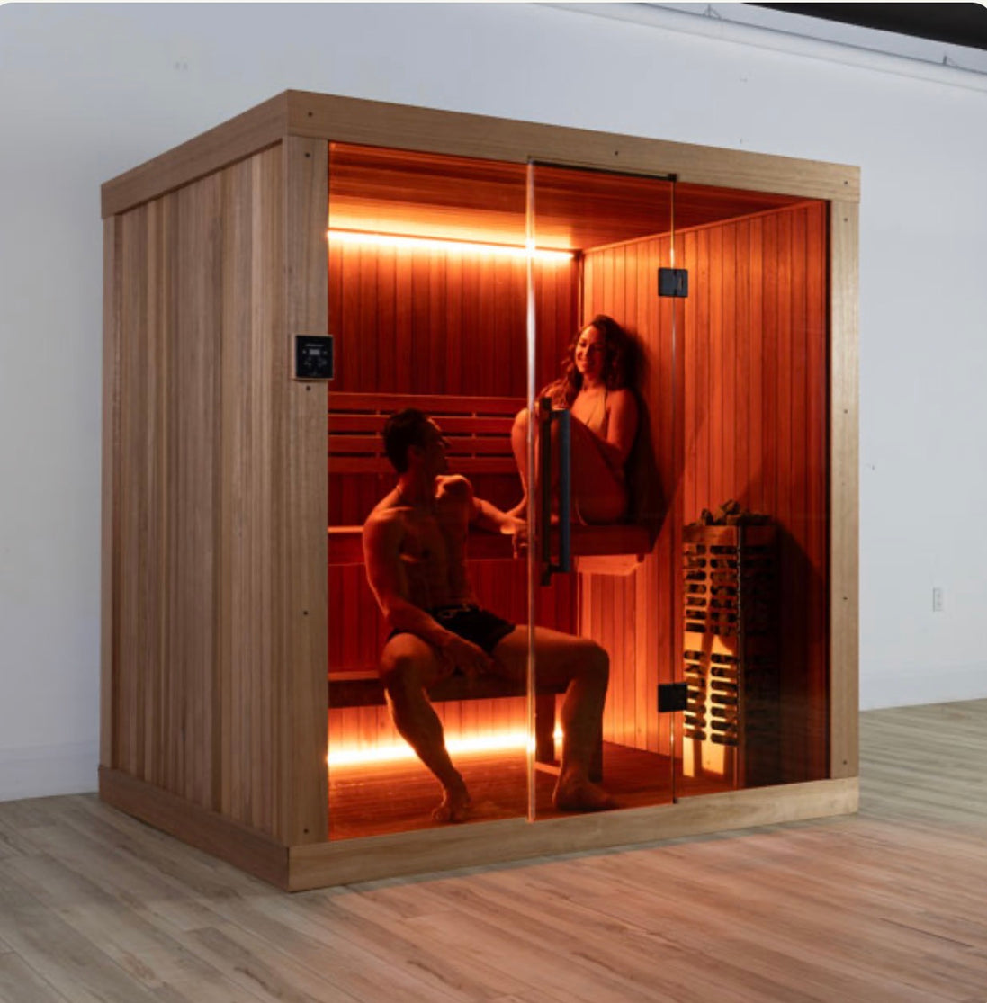 LeisureCraft CT Element Studio Indoor Sauna with wooden interior and glass door for relaxing home spa sessions.